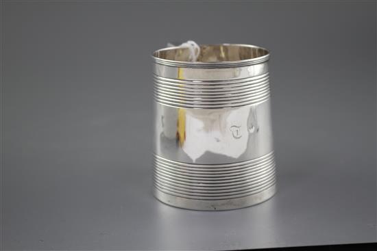 A Georgian reeded silver mug, (marks rubbed and top of handle is repaired), height 96mm, 8.5oz.